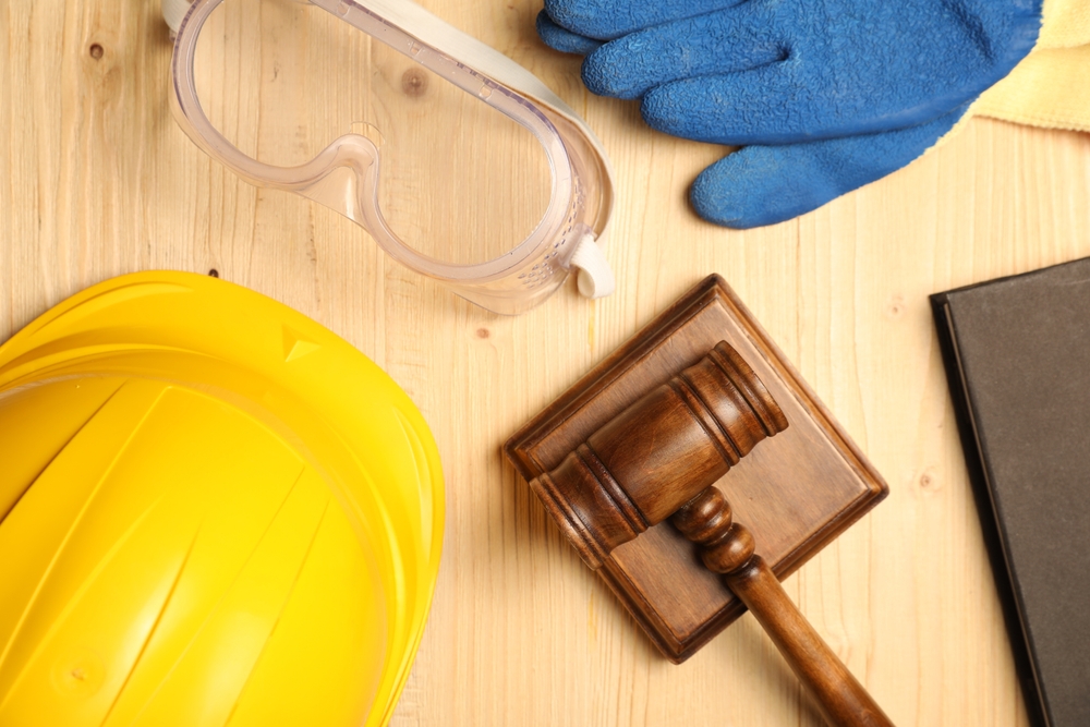 Construction safety gear and gavel representing legal rights during a construction accident lawsuit