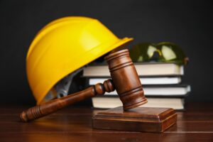 Gavel and construction hard hat representing legal guidance for injured construction workers
