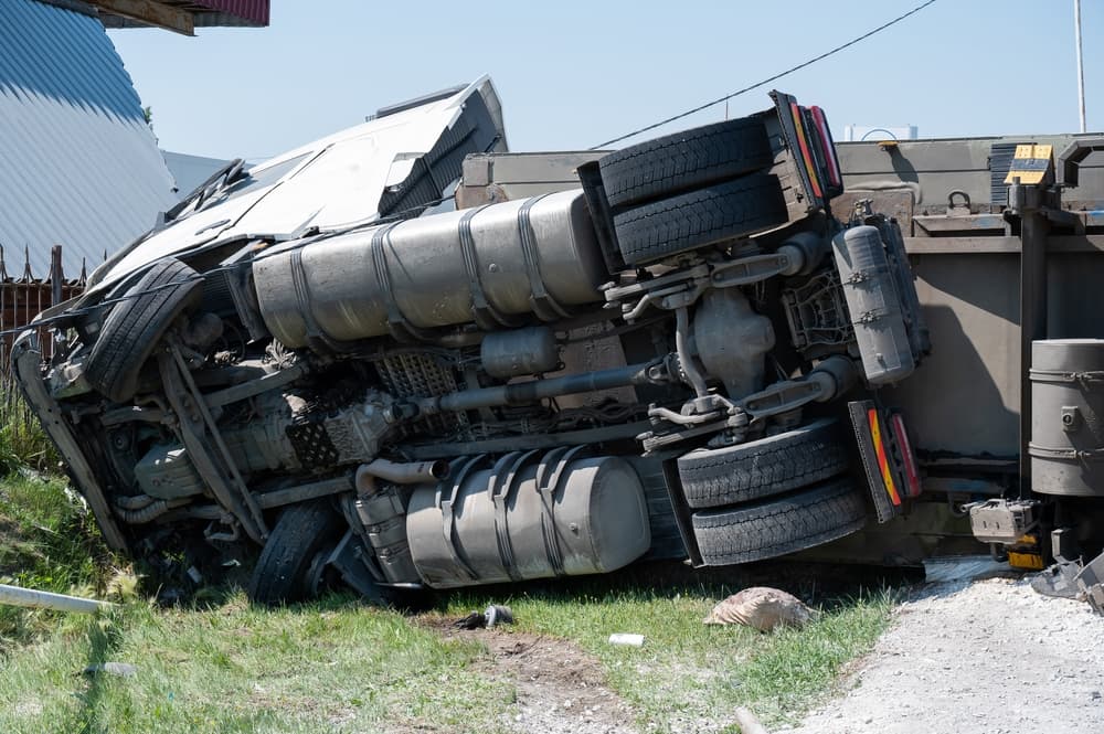 The truck is lying on the highway after accident