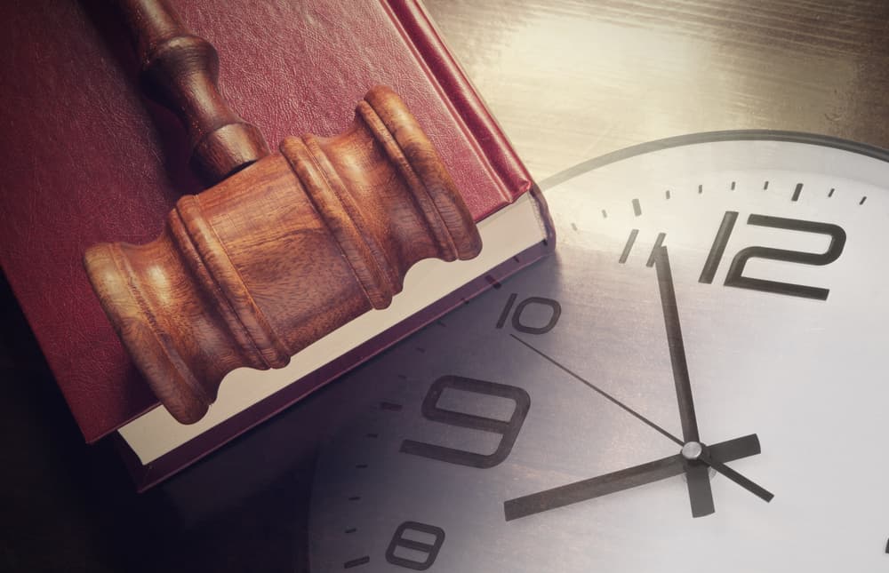 Clock, Gavel, and a book - concept of legal timeline