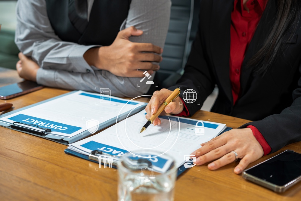 Lawyers review legal documents for a client