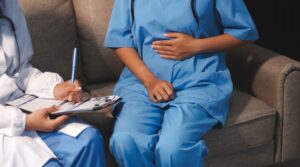 Woman with pregnancy concerns speaking to doctor
