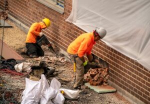 Construction workers doing project on building facade