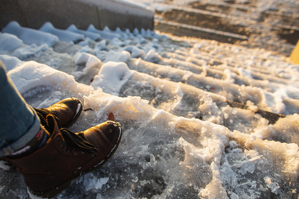 Ice and snow on the stairs leading in and out of an apartment building